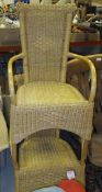 Two wicker elbow chairs