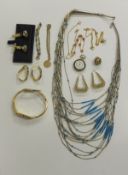 A collection of costume jewellery to include two pairs of gold earrings, a pearl necklace with