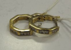 A pair of 18 carat gold stone set loop earrings