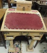 A pine Davenport desk with red velvet upholstery to the lid