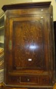 A 19th Century oak corner cupboard with drawer to base flanked by two dummy drawers
