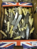 A box of assorted plated cutlery
