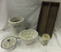 A collection of assorted kitchenalia to include jelly moulds, pine rack, bread board, a Pulton &