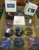 Fourteen assorted glass paperweights, mainly by Caithness