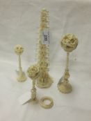 An early 20th Century ivory pagoda together with three carved puzzle balls on stands   CONDITION