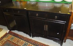 Two similar Oriental style ebonised cabinets of two drawers over two cupboard doors   CONDITION