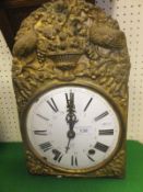 A 19th Century Morez wall clock with embossed brass face and circular enamel dial with Roman and