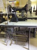 A large Singer sewing machine raised on a metal treadle base   CONDITION REPORTS  Bears label "