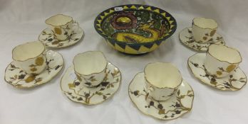 A set of six Hammersley & Co. porcelain coffee cups and saucers, decorated in gilt with flowering