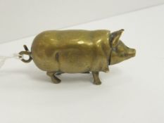 A late Victorian brass vesta case in the form of a pig