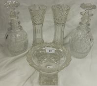 Two cut glass decanters, two cut glass vases and a cut glass bowl