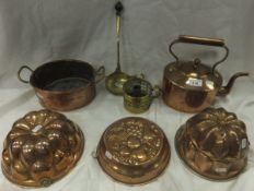 A copper kettle, twin-handled copper dish, brass ladle, brass candle snuffer, brass candlestick,