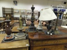 A collection of seven various table lamps to include a brass Corinthian column style table lamp