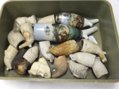 A box containing various clay pipe bowls and a meerschaum bowl, etc