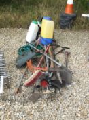 A collection of garden tools to include a spade, fork, lopper, saws, etc, together with a Flymo