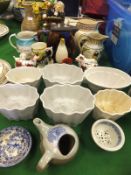 A collection of decorative pottery wares to include a pair of small Staffordshire spaniel ornaments,