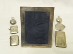 A box containing a silver mounted photograph frame of plain form, together with three silver vesta
