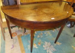 A mahogany demi-lune side table    CONDITION REPORTS  Top very scratched and with various splits and