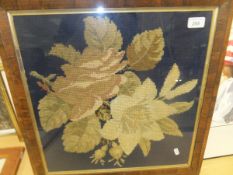 A rosewood framed and glazed needlework floral spray study, another needlework study and a colour