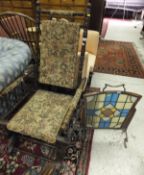 An American rocking chair upholstered in tapestry style fabric, together with an Art Nouveau style