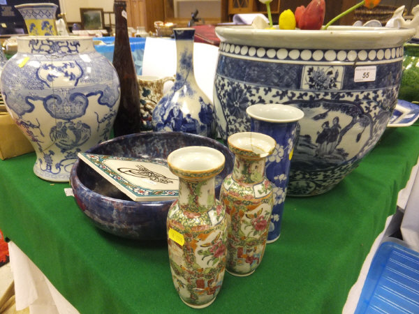 A large Chinese porcelain jardinier decorated in underglaze blue with figures in a landscape, a pair