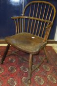 A 19th Century Thames Valley stick back elbow chair and a wheel and stick back chair