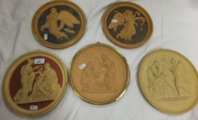 A collection of five large Copenhagen terracotta relief moulded circular plaques to include a pair