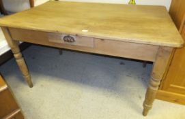 A 19th Century pine kitchen table with side drawer, raised on turned and ringed legs   CONDITION