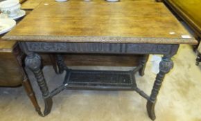 A Victorian oak rectangular Gothic revival centre table with turned and carved legs united by