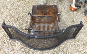 A cast iron fire basket, together with a cast iron fire back depicting a phoenix in flames, together