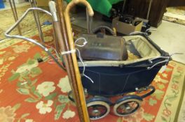 A doll's pram, doll's part tea set, pair of wooden boot lasts, pair of Taylor-Rolph Co. Limited lawn