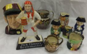 A Carlton ware pottery advertising figure "Pick Flowers Brewmaster", a Royal Doulton "Jockey"