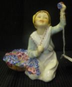 A Royal Worcester figurine "Italy" of young girl kneeling with basket of flowers, modelled by F.G.