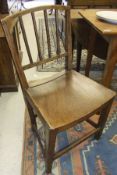 A set of four late 18th Century East Anglian elm country dining chairs with curved panelled seats (