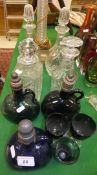 Four clear glass decanters, one by Royal Brierley, two 19th Century green glass stoppered flagons,