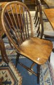 A pair of 19th Century beech, ash and elm stick back kitchen chairs with panelled seats