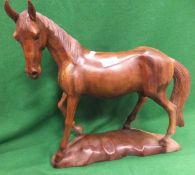 A carved wooden figure of a horse*