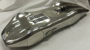 A cast metal model of a Mercedes Benz W125 Streamliner, bears label verso for "Compulsion Gallery