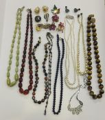 A box of assorted jewellery to include amber beads, tiger's eye beads, simulated pearls, etc