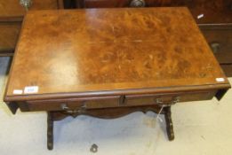 A reproduction mahogany and walnut veneered "sofa style" table with two drawers