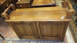 A 19th Century walnut duet organ stool with two panelled pull down music compartments on turned