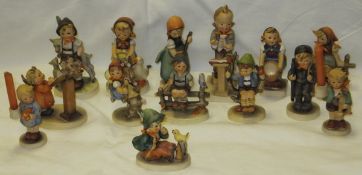 A collection of fourteen Goebel figurines to include "Way Side Harmony", "Little Sweeper", Little