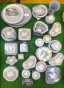 A collection of Wedgwood blue Jasper ware to include plates, lighters, lidded pots, dishes, etc