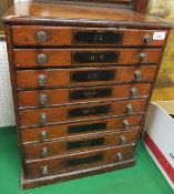 A stained pine chest of eight graduated drawers with brass handles   CONDITION REPORTS  A sewing /