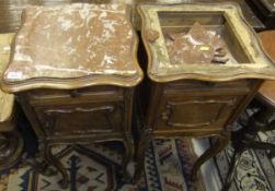 A near matching pair of 19th Century French walnut and marble top bedside cupboards with