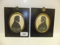 Two 19th Century silhouettes, heightened in gold and set in ebonised frames with brass mounts, one