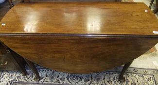 A circa 1800 mahogany oval drop-leaf dining table on turned tapering legs to pad feet