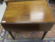 A 19th century mahogany Pembroke table with single end drawer on square tapering legs to brass