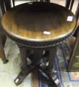 A late 19th Century table / piano stool by Tonk of New York / Chicago, retailed by Bristol