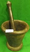 A large cast iron pestle and mortar